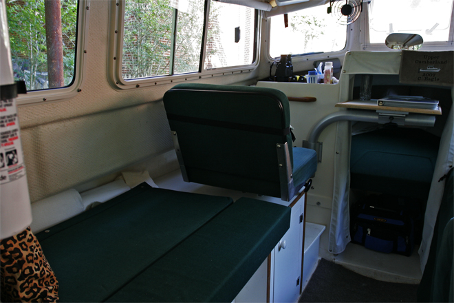 Port Bed and Seat shown with cushion to extend width. With extender cushion and support removed, port side is a bench seat as in the original commuter configuration, Copilot seat modified to slide and rotates.