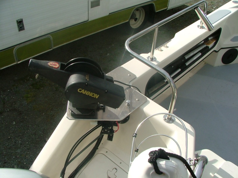 Port rigger and washdown pump mount.  3/8 " aluminum plate cut with a band saw, rounded edges with a router.  Washdown pump hangs beneath, intake hose hangs over the side as needed.