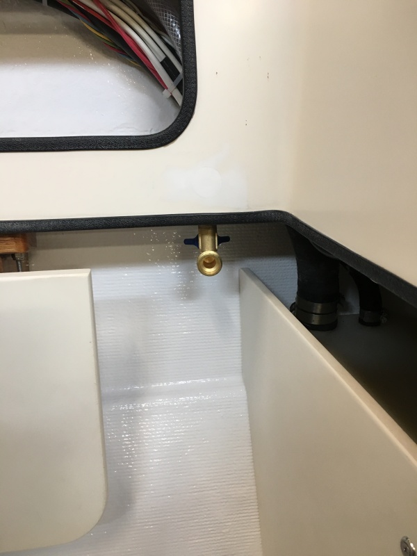 Potable water hose bib installed, connected to water pump in the V-berth, used for rinsing off feet after beach combing.