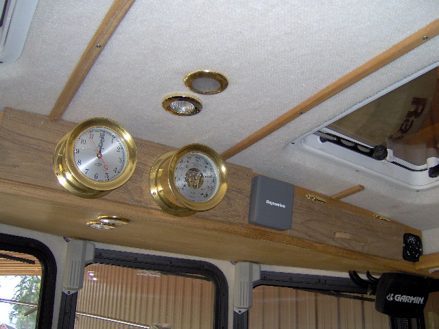 Put on teak doors on both sides.