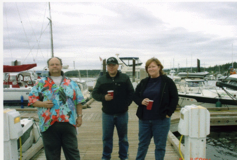 {R/J}: Rev. Jim with Harry & Patti Holman, christening of HOOKED II