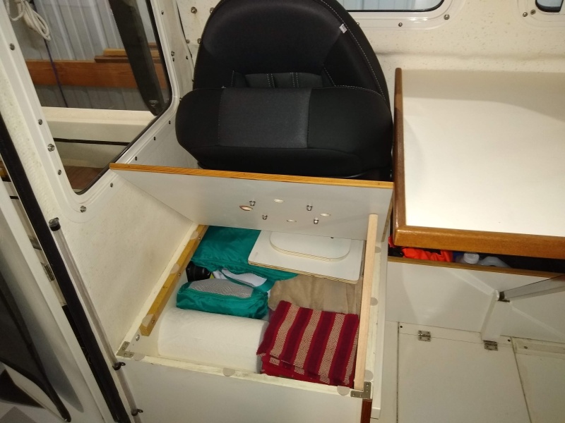Rear seat storage. I removed shelf above water tank to open up more room. We keep soft items here and has a fair amount of space above tank.