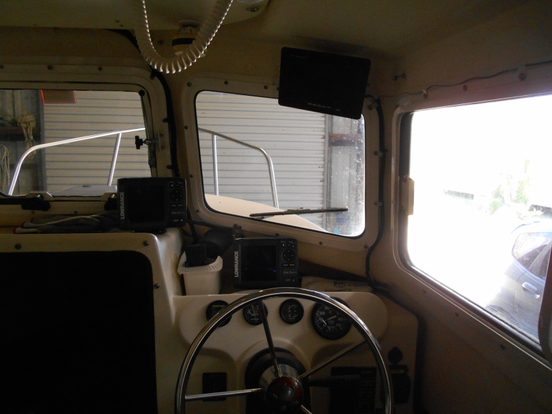 Rear-view monitor and on/off switch, over helm station.