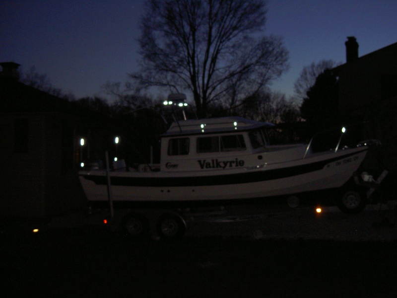 Reflective tape (ACR) added to make vessel more visible when anchored at night or when in distress.  A package of 12 sheets ($25 at West Marine) will do the whole boat.  Tape was added to bimini frame, radar arch, cabintop handrail supports and bow pulpit.  Highly effective at night, but not noticeable during the day.