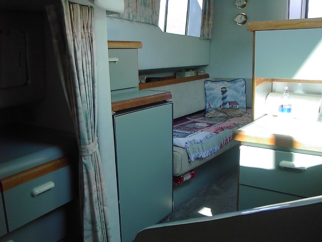 Refrigerator/Freezer accross from Galley. Pantry/storage above.