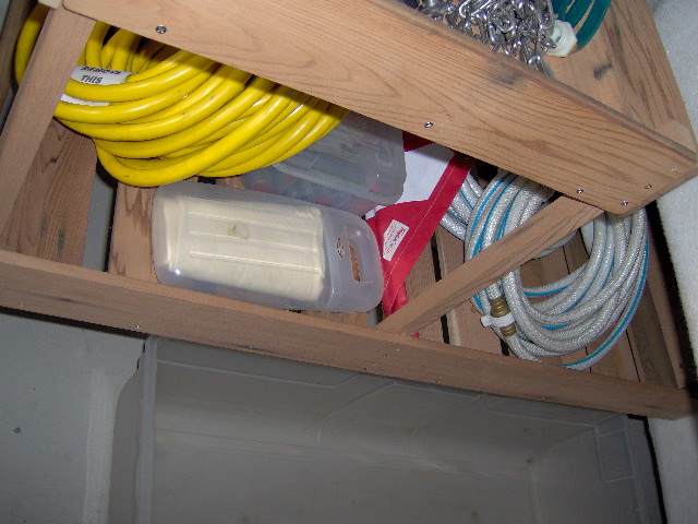 Remodel cave... two 39 inch plastic bins. Both slides under leaving all the space under shelving open