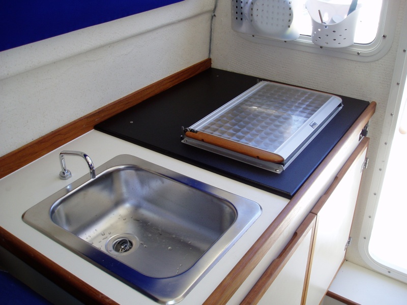 Replaced the "new" stove with the old.  New had smaller cutout but was placed way back on the counter.  They put a piece of starboard on that side of the counter and installed the old one!  Sportcraft Marina did a great job :)
