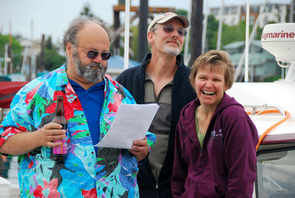 Reverend Jim  christens C-Dor? while Steve and Cindy look on