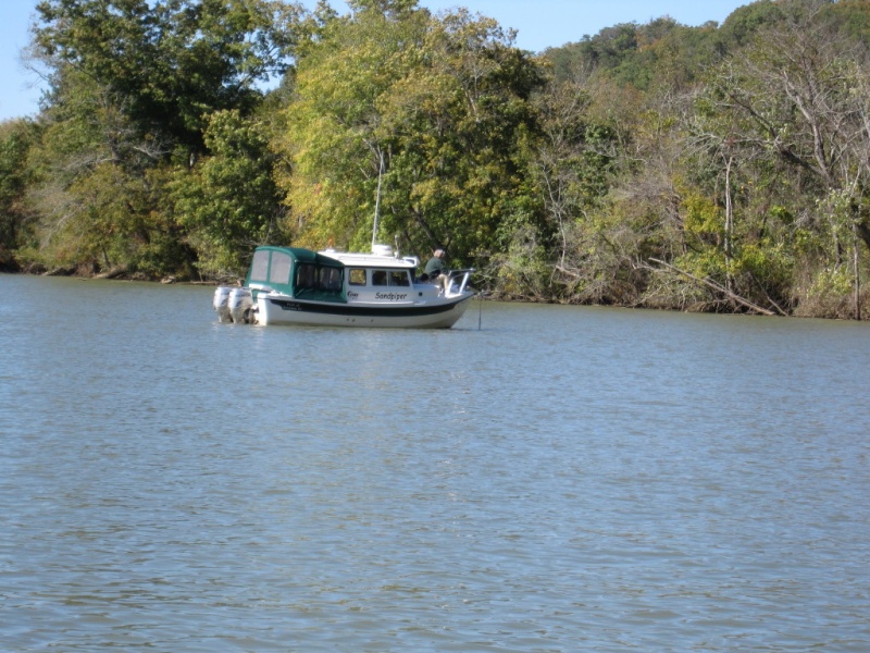 Rich on Sandpiper putting out anchor for us to raft up on the Harpeth River