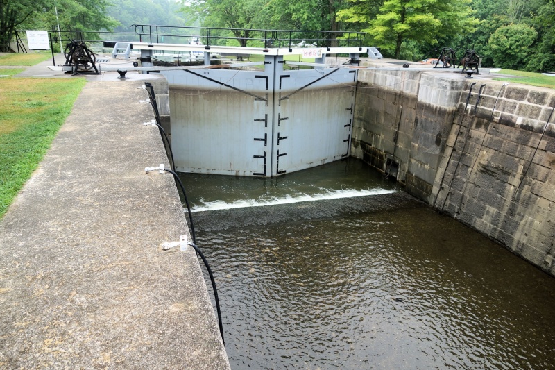 Richelieu typical lock, showing why 5.5 ft is the max draft advised.   Maneuver in for Eileen to take the bow cable, and me the aft cable.  All the ancient valves and gates are turned by  hand, mainly college kids on summer break but all very polite and friendly