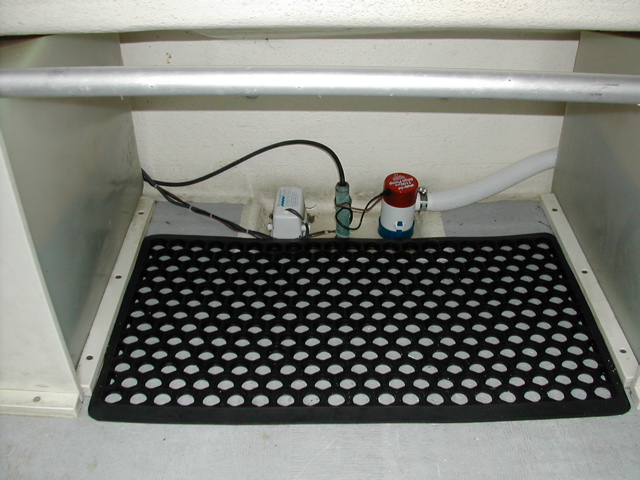(rogerbum) New bilge (2nd pump) and mat to keep cooler from sliding around.  Mat was $3 at Lowes, only needed to trim 1/8\" off both ends.