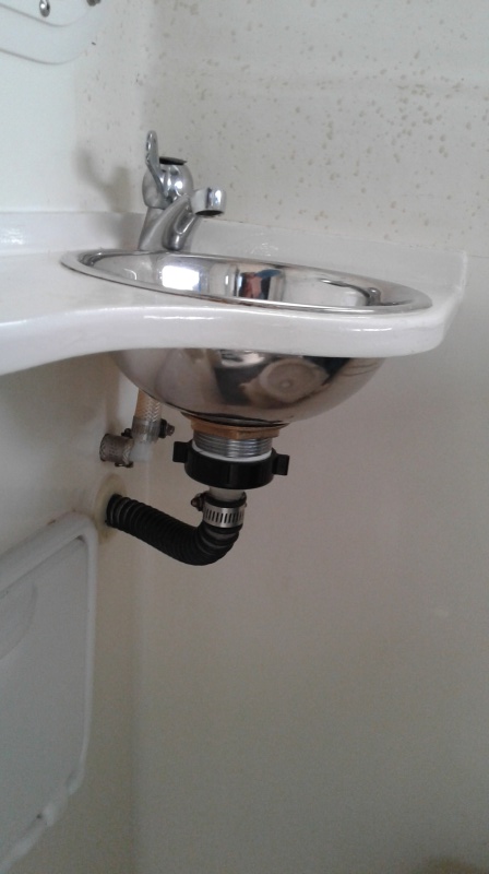 Running sink lines to under galley cleans up head area