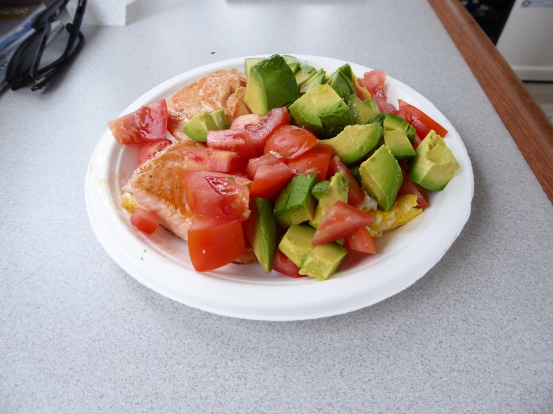 Salmon, eggs, tomatoes, and avocado for breakfast.  A strange mix.
