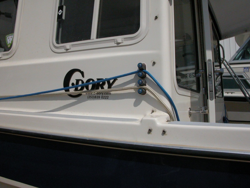 Sea Angel Port Cam Cleats- 1/2" gold 25' braid bow line thru bottom cam cleat, 3/8" blue 25' breast line through top cam cleat