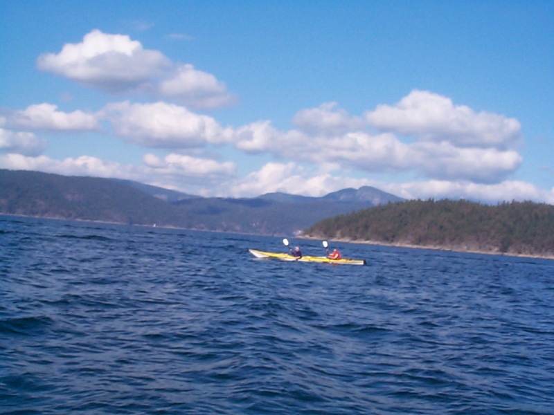 (seabran) Kayakers in double making a crossing - West of Mink Island.