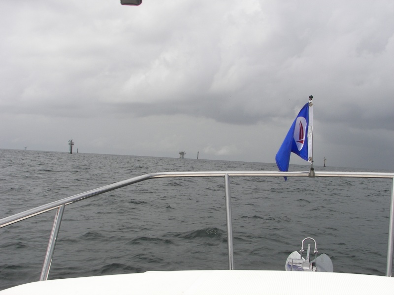 Seabrook Marina Burgee and oil rigs about 10 miles offshore. Tons of ships, rigs and things that go bump in the night off Galveston, TX.