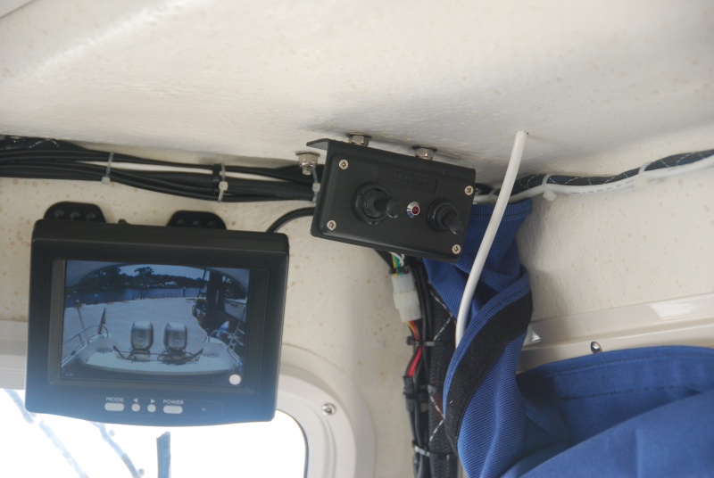 Search light controller and rear view camera LCD Camera Monitor share the top forward starboard cabin roof area.