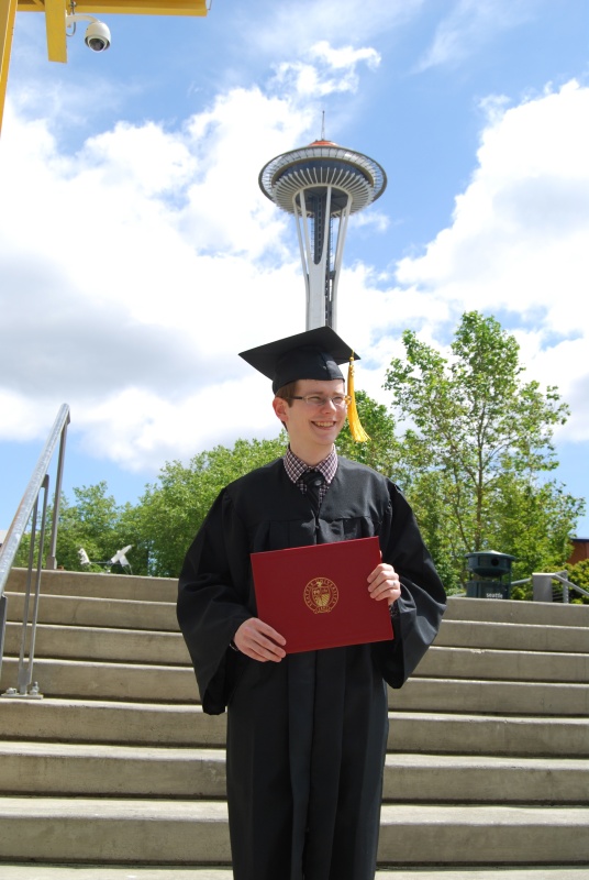 Showing off the diploma.