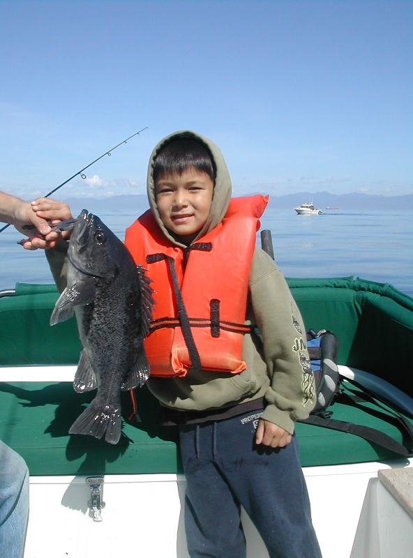 Sieku 2006 - Son with his first Black Sea Bass (AKA Black Rockfish)