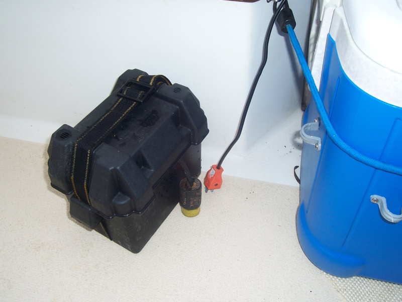 Small 12volt lawnmower battery, that plugs and plays to run the aerator. The raw water wash down fills the well. The aerator oxygenates the water. When water is added, the extra runs out the overflow, and into the cockpit drain.r