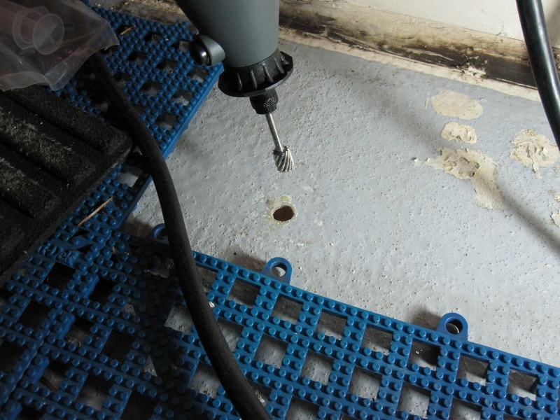 Somebody somewhere suggested this as an alternative to a bent nail or allen wrench. Very quick and smooth. Simply let the shaft ride against the laminate and proceed around the hole. A perfectly undercut cavity!