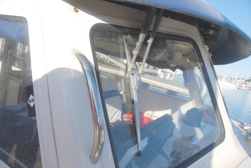 Standard 11.5" wipers and arms replaced with Pantographic arms and 14" SS Deluxe wipers. Adjustment of the 14" wiper position is straight forward with plenty of room for a full sweep. Adjust it parallel to the side in the park position. Either the SS Deluxe or SS Standard wiper(cheaper) could be used.