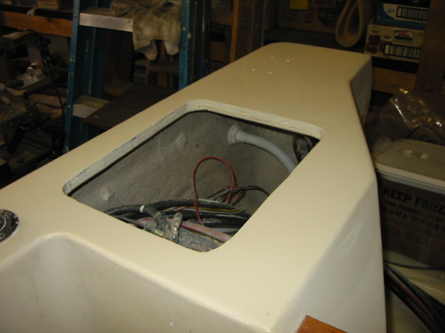 starboard lazarette.  More fine sanding, another coat, and install cover.