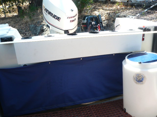 Starboard rail gives an illusion of safety from raised aft freeboard but somewhat at a cost of lesser ease of outboard access. Will build removable Starboard fish cleaning/serving table to fit rail.