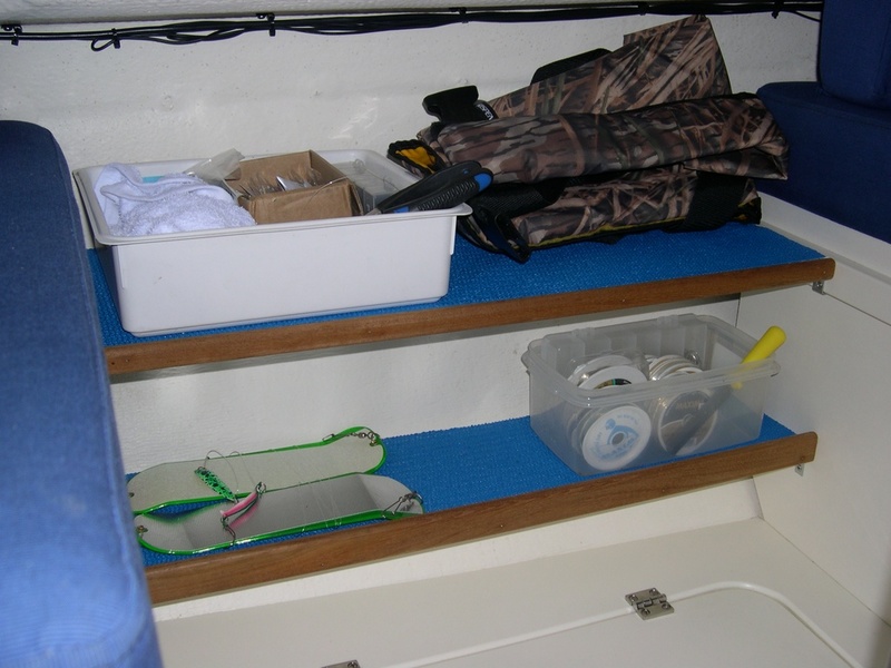 Starboard Shelves.  Idea, courtesy of another brat.  Top shelf includes two 1/2" x 2" slots for table brackets when dinette is converted to a bunk.