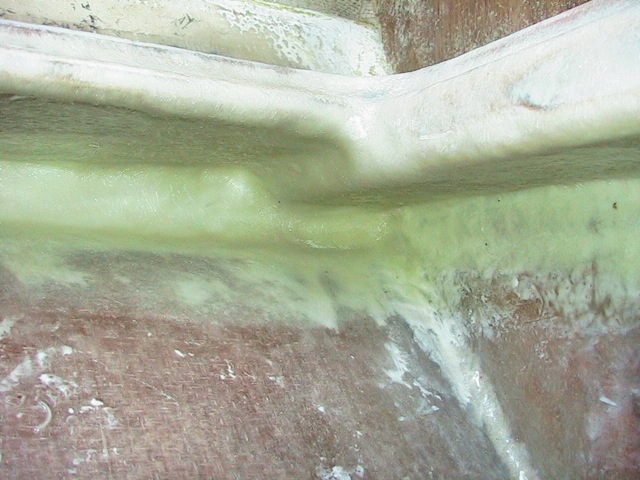starboard side by the helm - the thick part was just a 2x6 - you can see the glass bead was in the resin in these under-areas to help it all set up better :0|