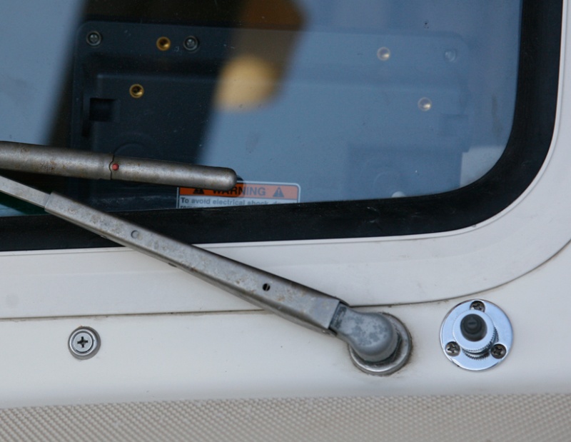 Starboard-Washer Nozzle Mounted in a small 3/8" cable mount fitting. The port nozzle is identical.