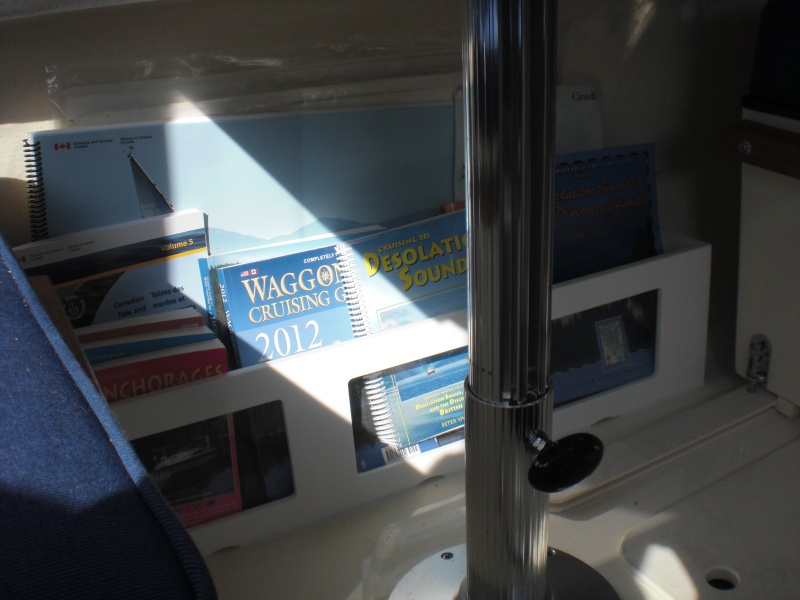 Storage bin under table for books and charts. Made out of starboard with perspex windows.