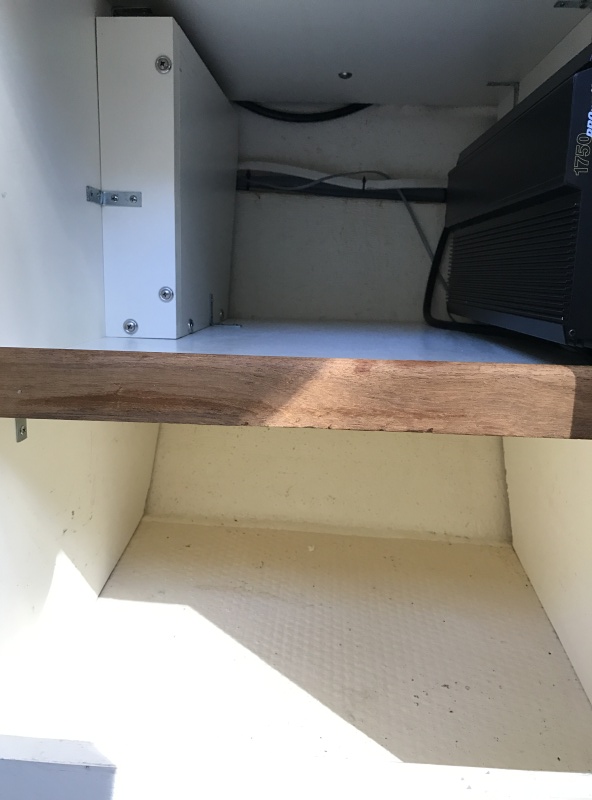 Storage cabinet under helm seat with 1,750 watt inverter.