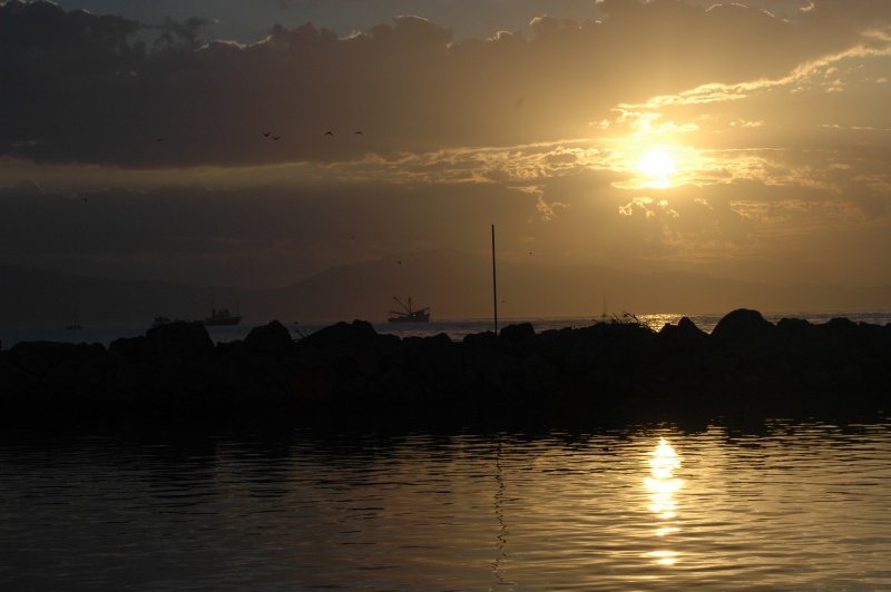 Sunrise over the breakwater in Santa Barbara harbor.