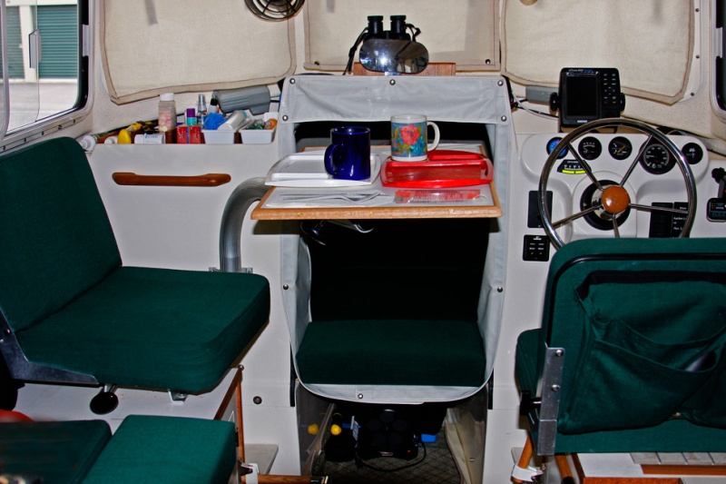 Table rotated lengthwise;it can be swung toward the aft direction and used as a counter surface if the galley is being used to cook for more than a couple of brats.