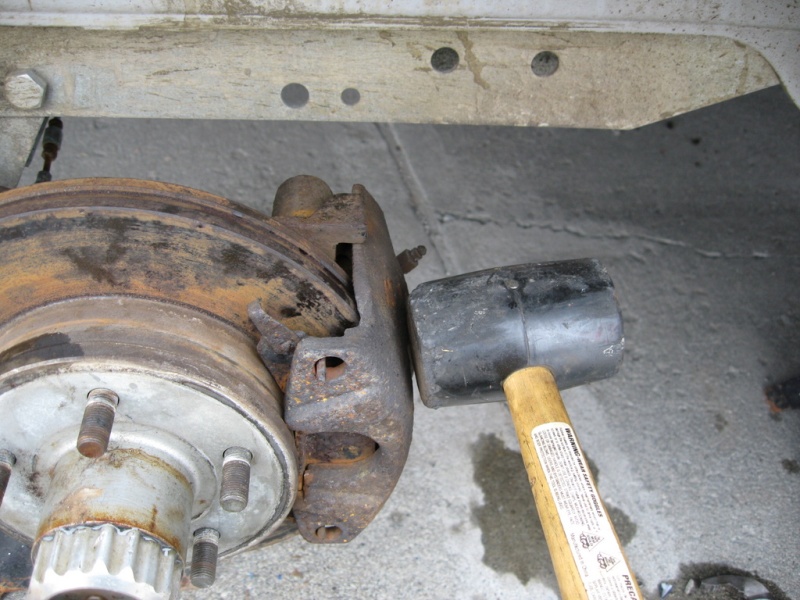 Tap the rusty hideous looking caliper and pads back in place; next year I?ll put on some new pads.  Run in the caliper bolts and you?re done.