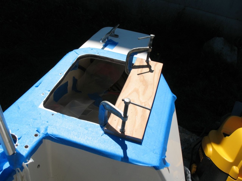Testing fit of forming board, clamps.  Clamps have blue tape on them to ward off epoxy. Forming board covered in clear packing tape.