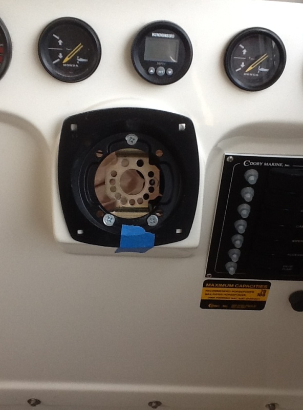 The adaptor in the hole but not bolted in yet