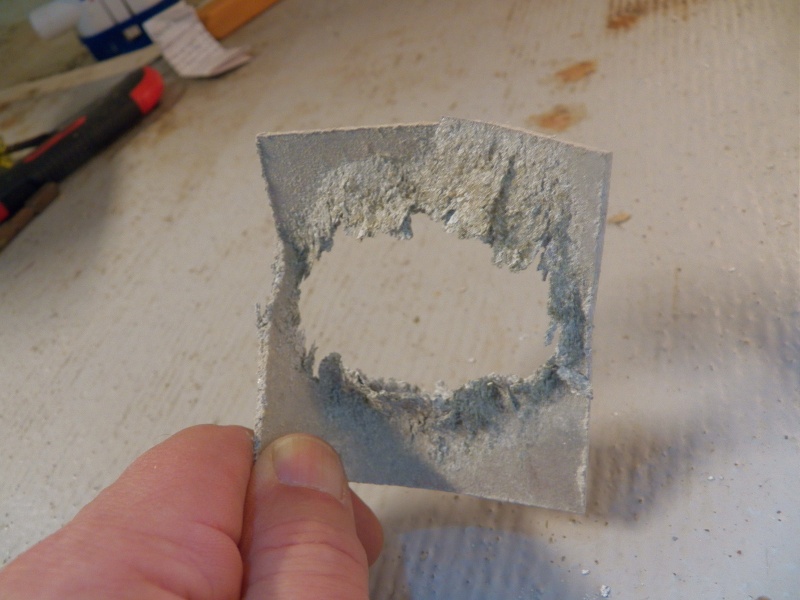 The aluminum backing plate was almost gone.  I feared it was because the balsa core was wet enough to start a battery between the stainless steel and the aluminum. I reached up and pulled the backing plate off.  Obviously, it wasn't doing anything other than sprinkling powder into the cockpit.