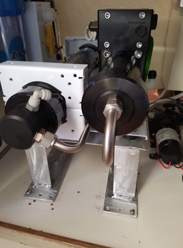 The aluminum shelf elevates the Ckark pump, it engages lugs at the rear so it easily slides out for maintenance.
