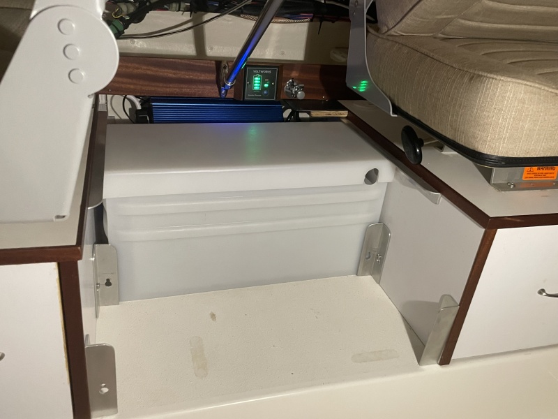 the battery weighs 135 lbs and can be shifted 10\" towards midship to help trim when single handing... then moved starboard with passngers.   Eventually, if needed I can add a second there in parallel for mucho amp hours