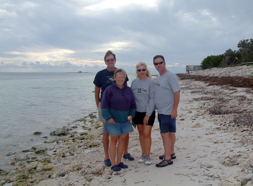 The crews of Discovery and Wild Blue on the beach