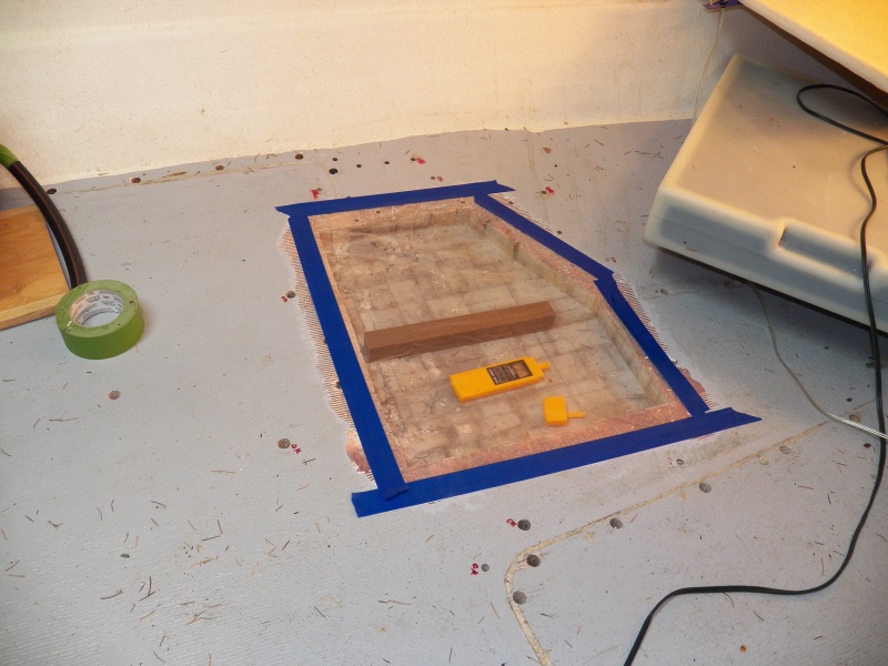 The deck has now been opened for two months in a heated garage with a heating mat placed on the deck and heat lamps underneath.  Here, I covered the opening in the deck with plastic with a psychrometer (air moisture meter) enclosed.  Relative humidity in the garage was now down to 50%.  After 24 hours applying heat to the surrounding area, it only got to 60% RH inside of the plastic.