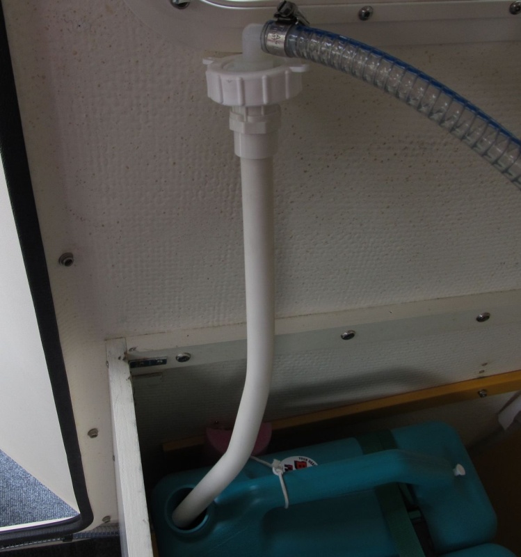The dip tube is a ~2 foot section of 1/2" PVC water pipe.  I heated it up with a heat gun and bent it to shape so it would get into the lowest corner of the tanks. It just friction fits into the fitting above it.