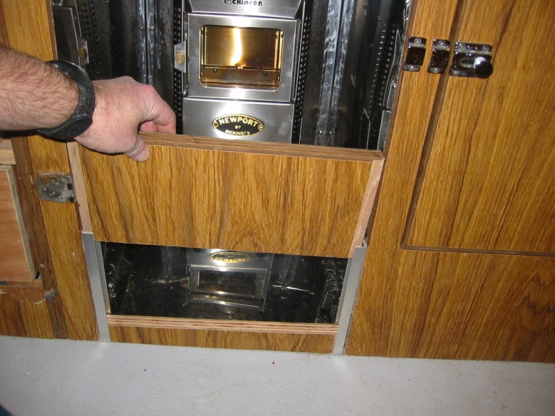 The door and lower kick panel come off for unobstructed air flow. The heater has a 12 volt fan. (Rock-C)