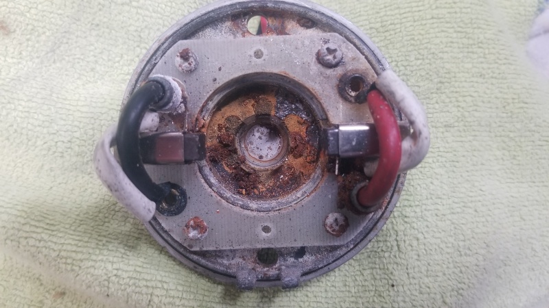 The end bell of a Lewmar V700 windlass motor, showing corrosion of the armature bushing clip
