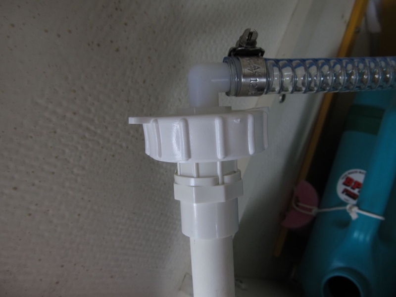 The large ring is the one that comes with the water jug (as is the flat cap I drilled).  I just made one of these and can move it from tank to tank.  I plan to fill the tanks in place.  The hose is the one that runs normally to the foot pump; I just left it extra long when I replaced it.  I'll cut it down to size when I put in the new/permanent water tank.  More info in "Sunbeam ~ 22 Cruiser" thread.