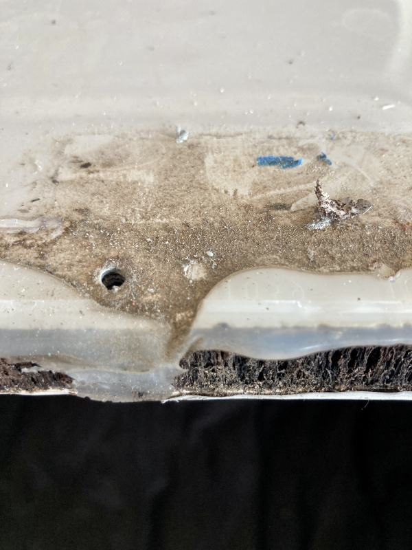 the leaks came from under the hinges where the caulk had not quite spread out all the way to create a seal