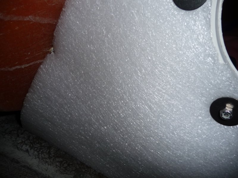 The machine screws are 1-3/4" long and are nutted to hold the hatch in place, then nutted again with fender washers to hold the insulation in place. The perimeter of the sheet insulation is wedged in place by fit and the reverse angle of the hull.