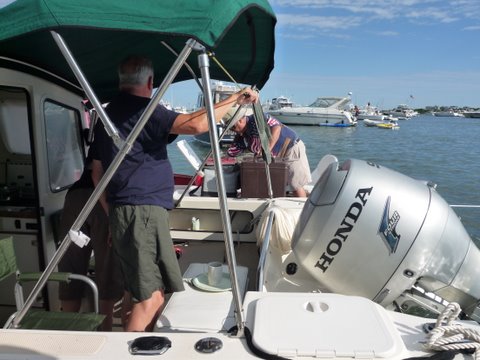 The Pastry (Aldo) man getting together our order the morning of July 3rd anchored in the salt pond on Block Island